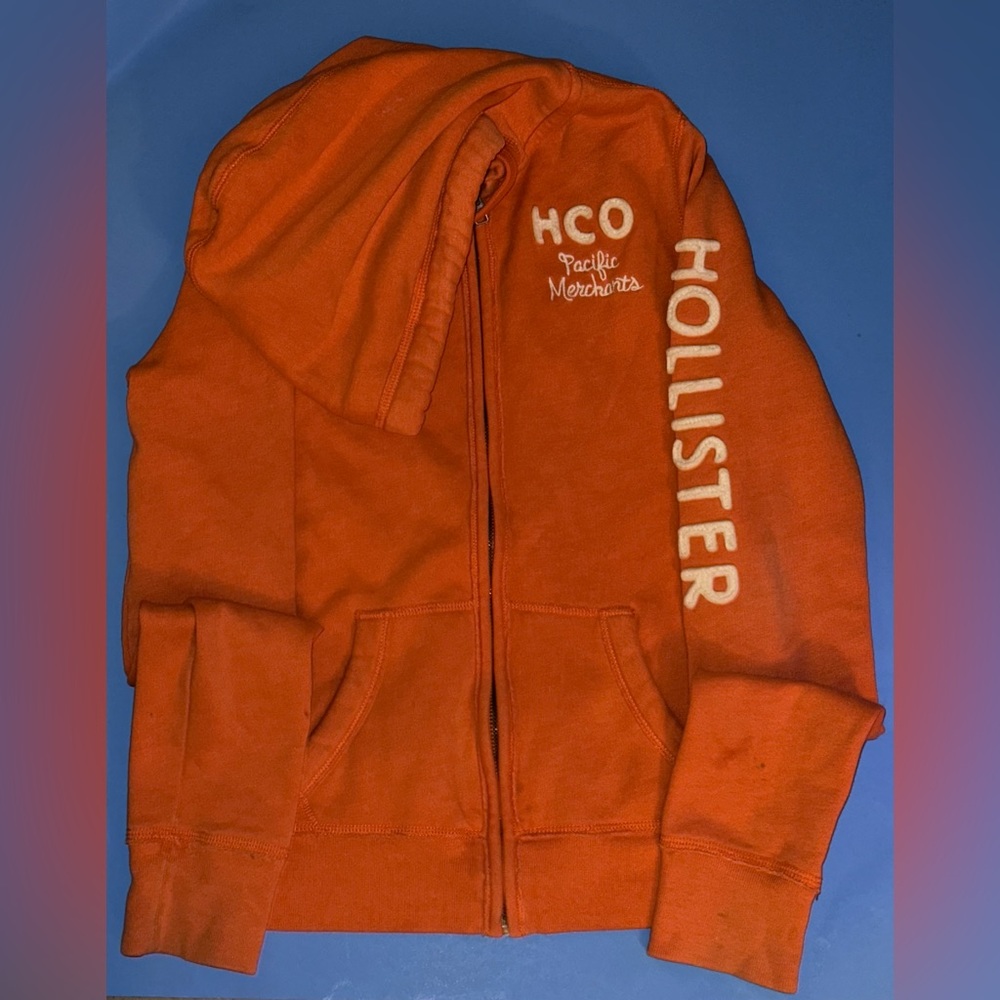 women’s medium orange Hollister zip-up jacket 
minor stains shown in the photos